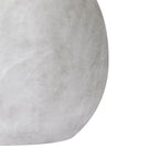 Close-up of the Brushed Orb Vase's curved side, showing faint brushed-looking marks and soft grey-white tonal variation.