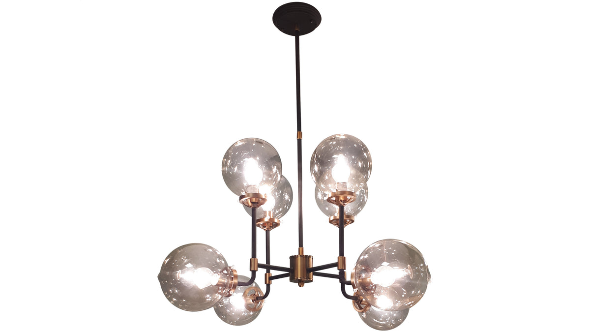 Bubble Chandelier shown illuminated against white, with eight glass globes on black arms, brass-coloured details and a long rod beneath a round dark canopy.