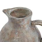Close view looking into the jug's open neck, showing the projecting spout, mottled rim and upper handle.