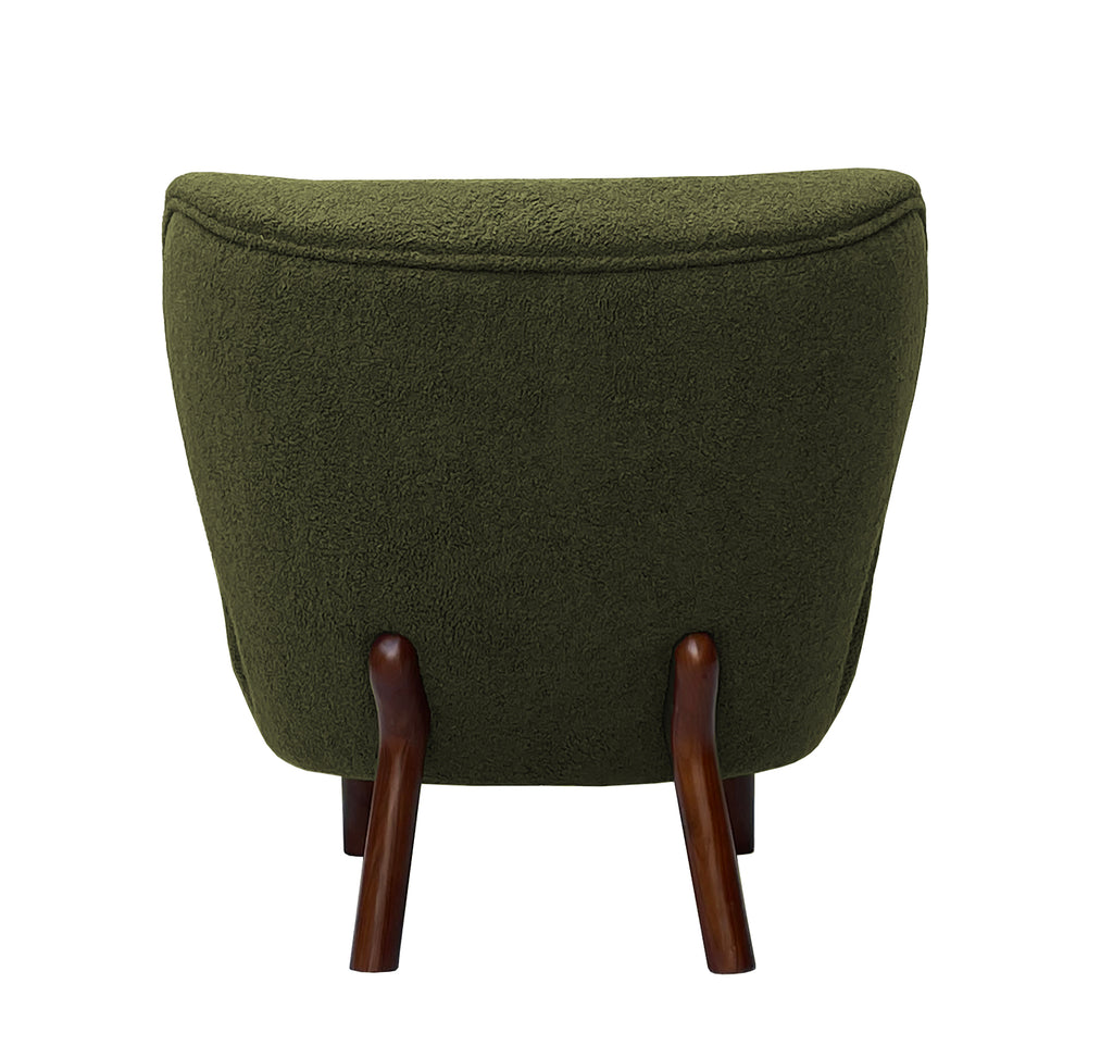 Straight rear view of the chair showing its broad upholstered back, curved piping and two splayed brown wooden rear legs.