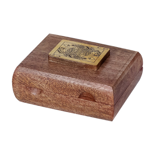Closed mango wood card box viewed from above at an angle, showing the raised brass Queen of Spades and front finger notch.