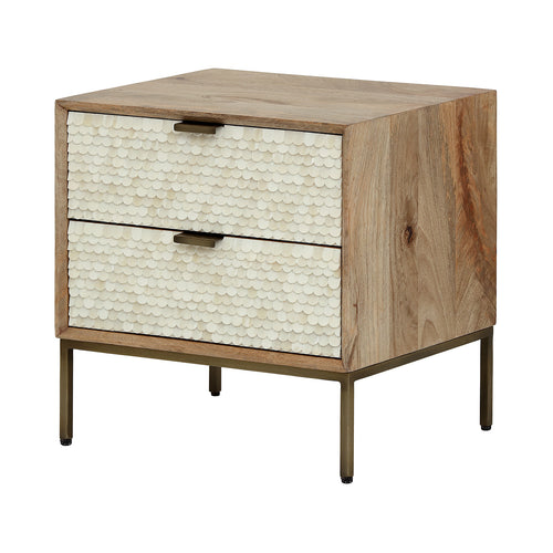 Three-quarter view of the Cartouche bedside table with cream scalloped drawer fronts, light wood casing and slender metal legs.