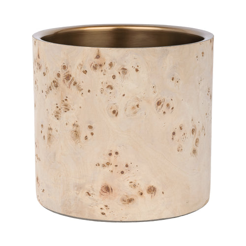 Front view of the cylindrical champagne cooler with pale burl veneer and a brass-coloured rim and interior.