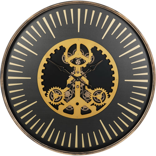 Front view of the round black wall clock with gold-coloured stroke markers, central cogs and shaped black hands.