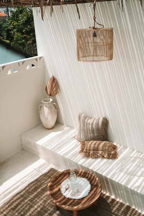 Chacha Rattan Pendant Light – Natural, Medium – styled above a daybed