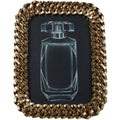 Front view of a gold chain-link photo frame with a white perfume-bottle drawing on a black insert.