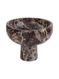 Angled view of a dark red marble footed bowl, showing its curved interior, cream veining and cylindrical pedestal.