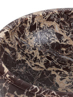 Close-up of the bowl's polished rim and interior, with cream veins running through dark burgundy marble.