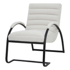 Front three-quarter view of a pale accent chair with horizontal upholstered channels, capped curved arms and a black runner frame.