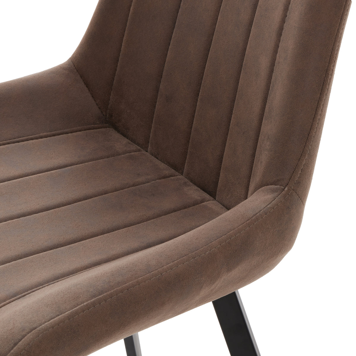 Close-up of the mottled brown upholstery, showing channels across the seat and back and stitching along the curved side.