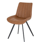 Angled view of a tan dining chair with a curved armless shell, stitched channels and four black splayed legs.