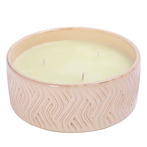 Angled view of the Chant Candle showing three evenly spaced wicks in pale cream wax inside the wide patterned ceramic bowl.