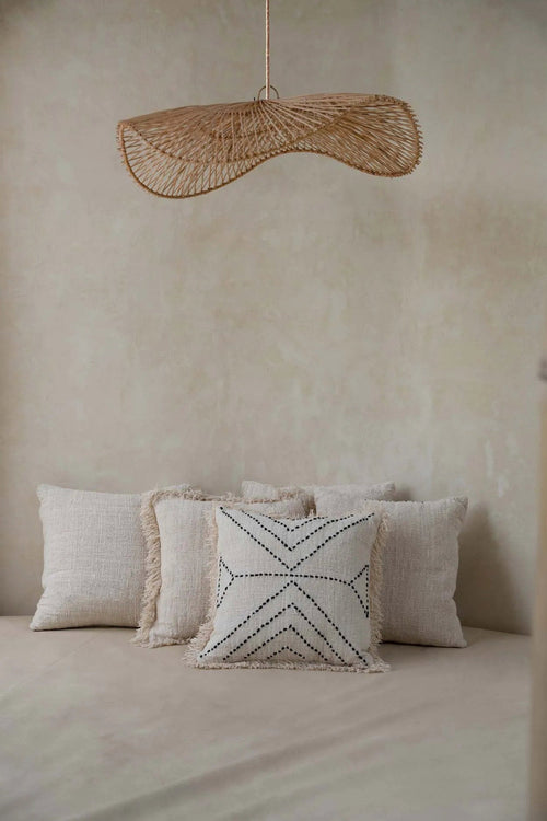 Chapeau Rattan Pendant Light – Natural, Large – styled above a bed