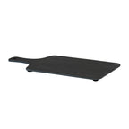 Low angled view of the charcoal serving board showing its thin edge, rounded corners and black pads beneath.