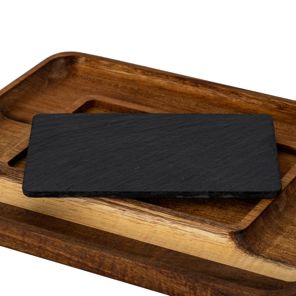 Dark rectangular insert resting diagonally across the tray, revealing part of the recess beneath it.