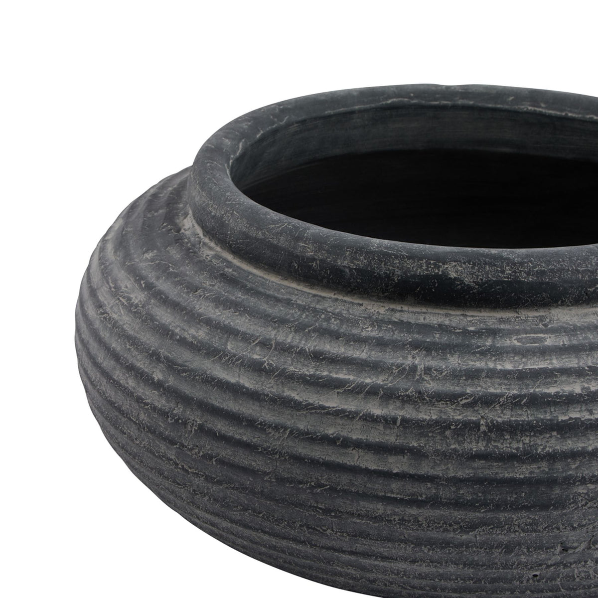 Angled close-up of the planter's rounded rim and dark interior, with pale mottling across the charcoal-grey ribs below.