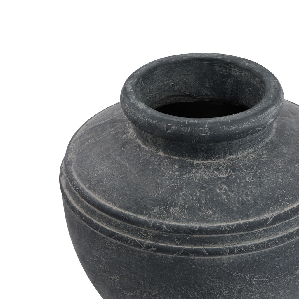 Angled close-up looking into the planter's open neck, showing the thick rounded rim and mottled grey shoulders.