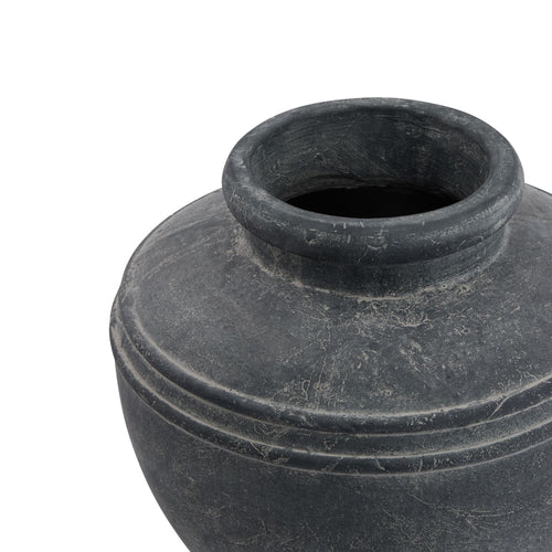 Angled close-up looking into the planter's open neck, showing the thick rounded rim and mottled grey shoulders.
