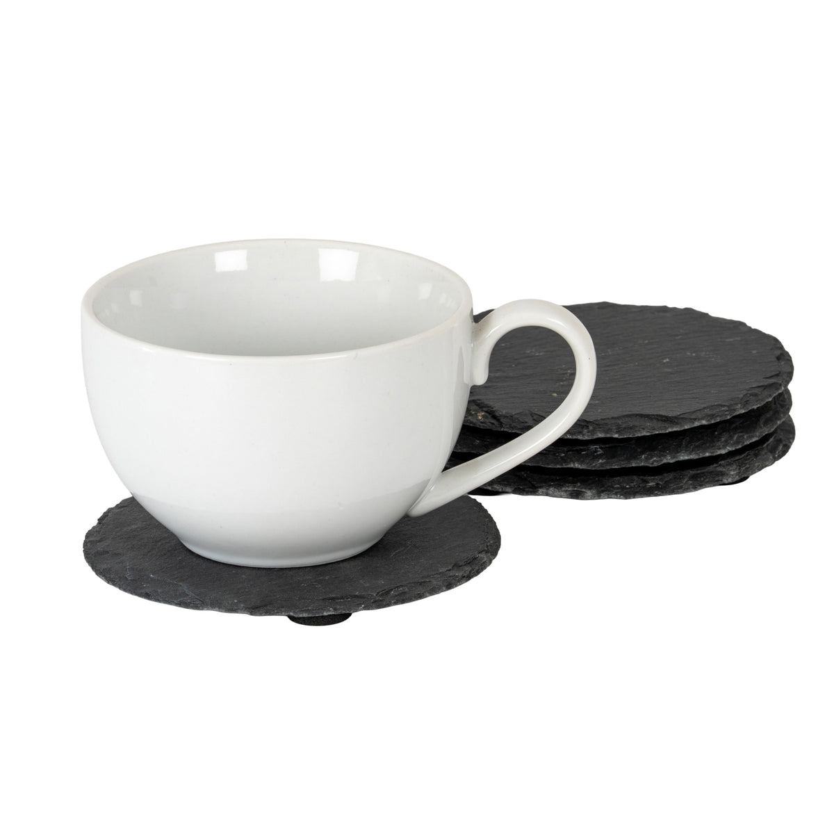 White cup resting on a charcoal round coaster, with the other rough-edged coasters stacked behind it on a white background.