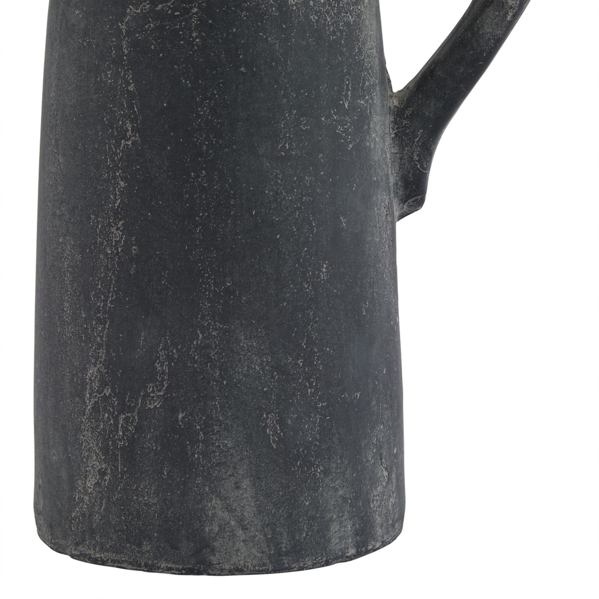 Detail of the jug's lower charcoal-grey body and rounded base edge, with fine pale irregular lines and the lower handle attachment visible.