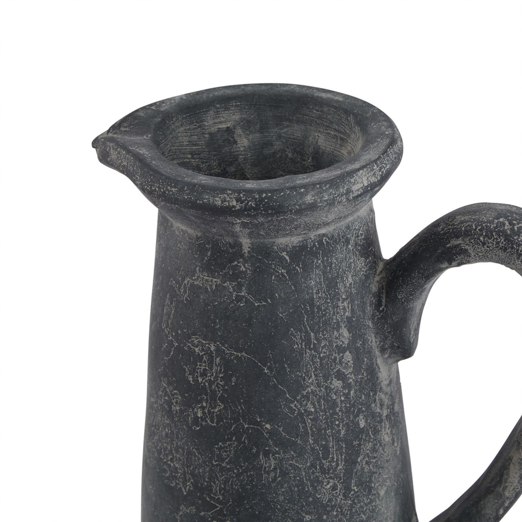 Close view of the jug's open flared rim and small spout, showing pale rubbed markings around the neck and upper handle.