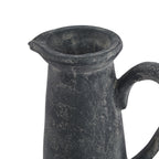 Close view of the jug's open flared rim and small spout, showing pale rubbed markings around the neck and upper handle.