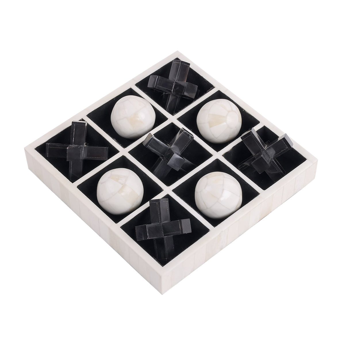 Angled view of the square noughts and crosses board with five black crosses and four pale rounded pieces in recessed cells.