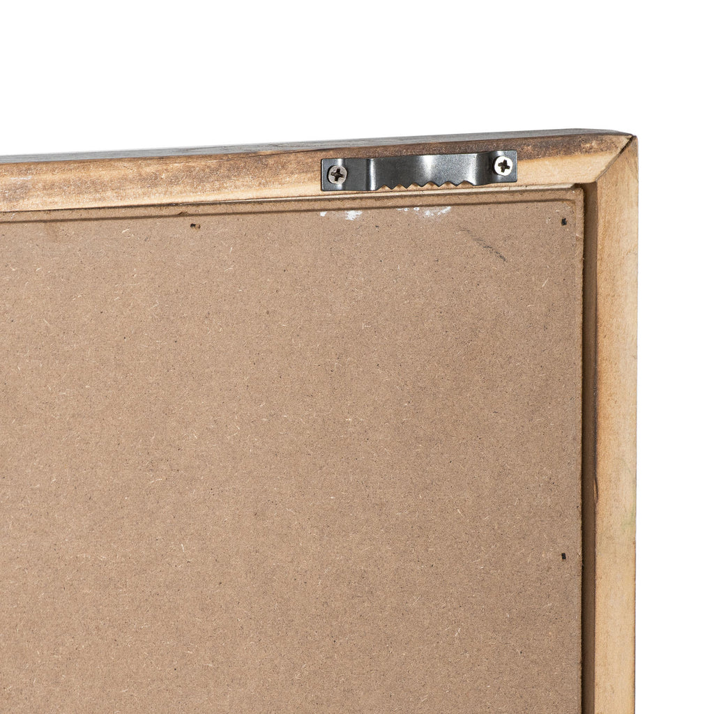 Rear corner of the plaque showing a brown backing, angled frame corner and a silver-coloured toothed bracket secured by two screws.