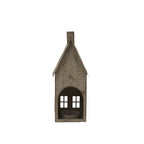 Rear view of the house-shaped candle holder with an arched opening revealing a low mottled cup and the front windows beyond.