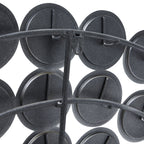 Close-up of the mirror's rear, showing dark circular backs, curved support bars and a keyhole-shaped hanging fitting.