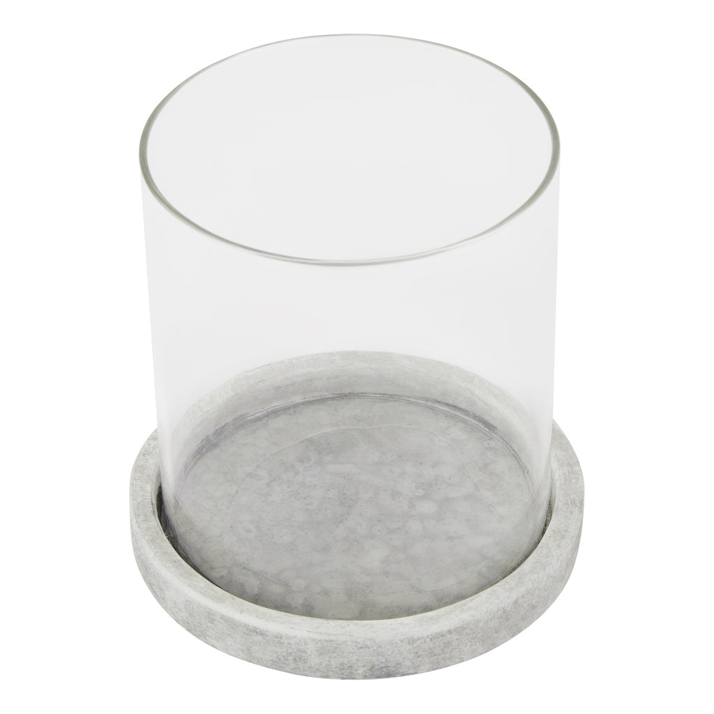 Candle lantern viewed from above, showing the open circular sleeve and the mottled pale grey surface inside its round base.