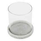 Candle lantern viewed from above, showing the open circular sleeve and the mottled pale grey surface inside its round base.