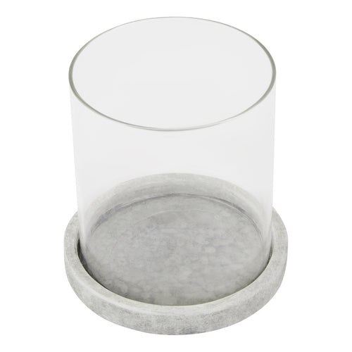 Candle lantern viewed from above, showing the open circular sleeve and the mottled pale grey surface inside its round base.