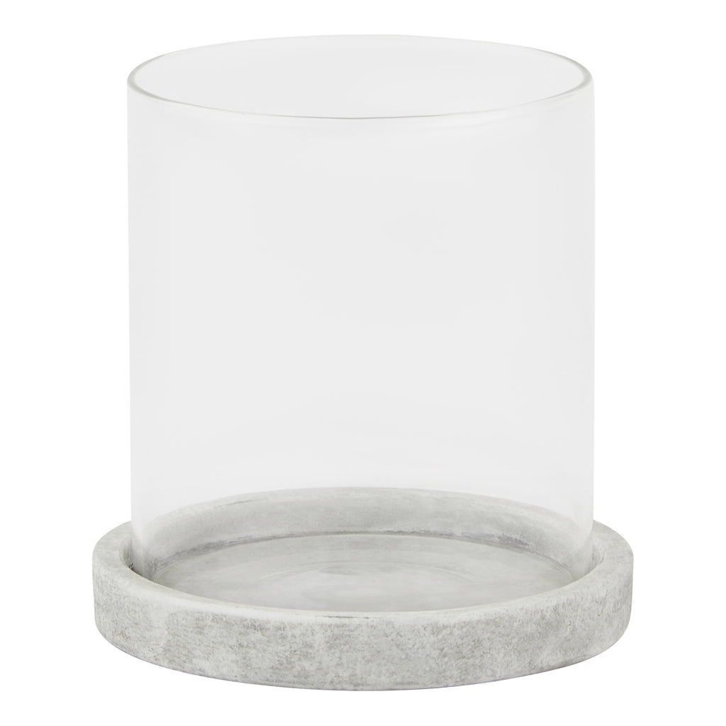 Front view of a clear cylindrical candle lantern with a shallow pale grey round base and mottled finish.