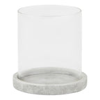 Front view of a clear cylindrical candle lantern with a shallow pale grey round base and mottled finish.