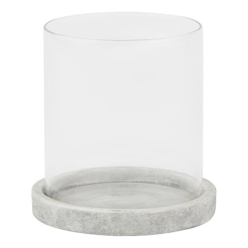 Front view of a clear cylindrical candle lantern with a shallow pale grey round base and mottled finish.
