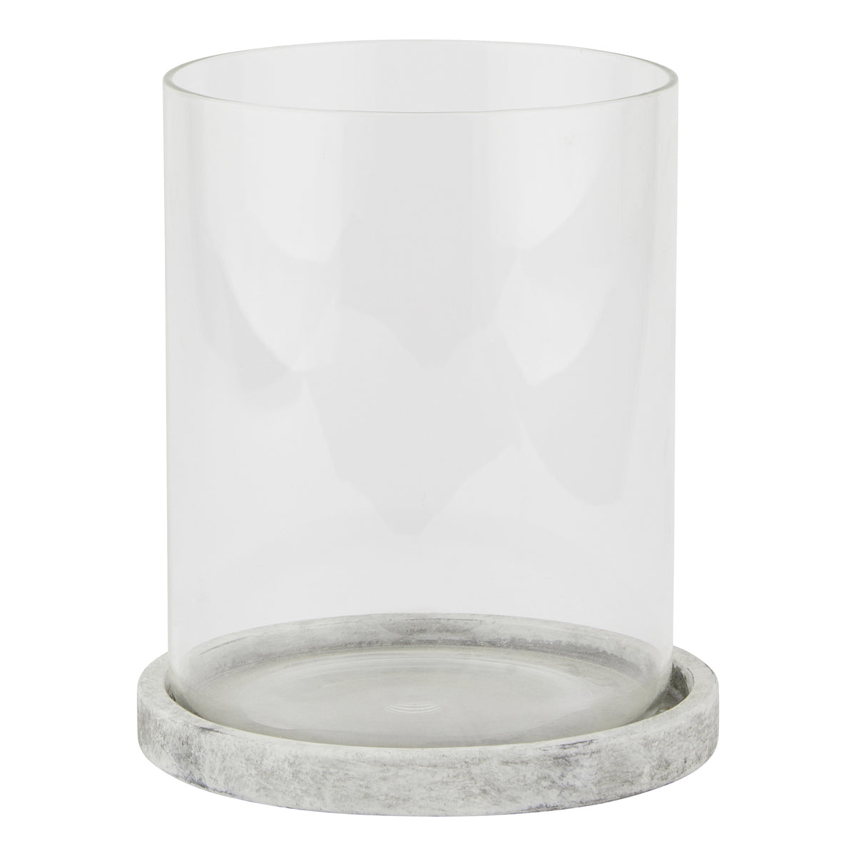 Front view of a clear cylindrical candle lantern on a shallow pale grey round base with mottled markings.
