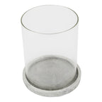 Candle lantern viewed from above at an angle, showing the open circular top, clear sides and grey markings across the round base.