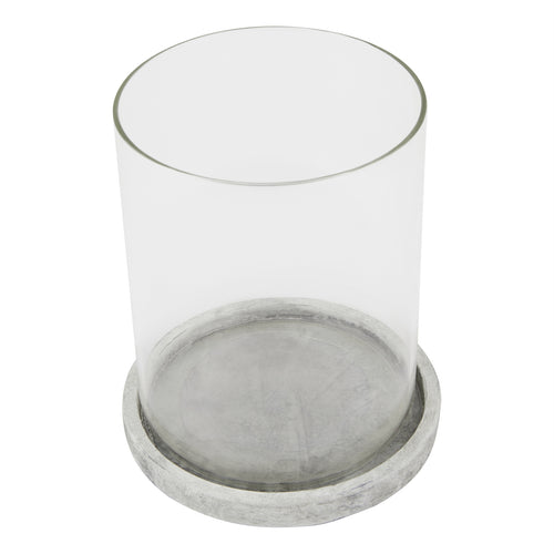 Candle lantern viewed from above at an angle, showing the open circular top, clear sides and grey markings across the round base.