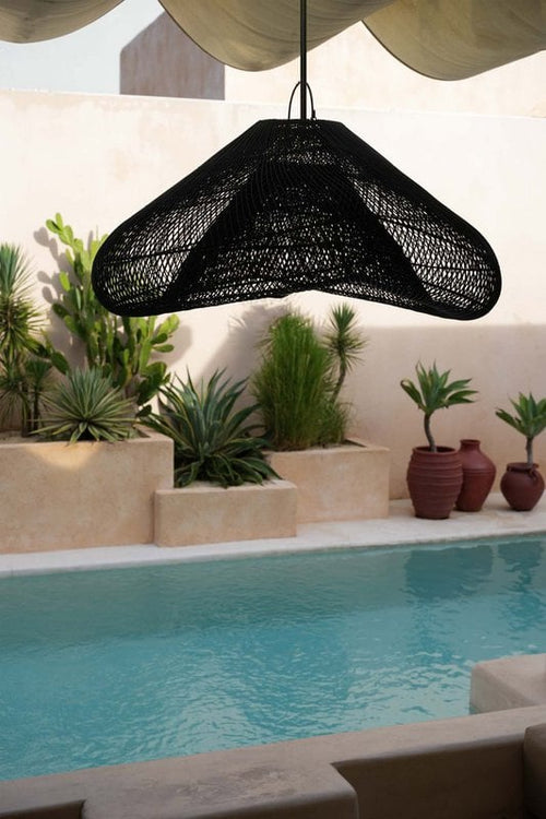 Cloud Rattan Pendant Light – Black, Extra Extra Large — styled beside a pool