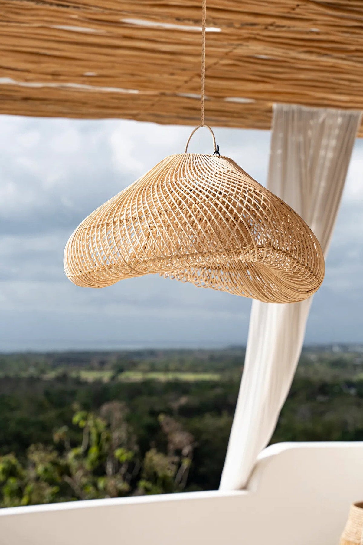 Cloud Rattan Pendant Light – Natural, Medium — outdoor-styled side view