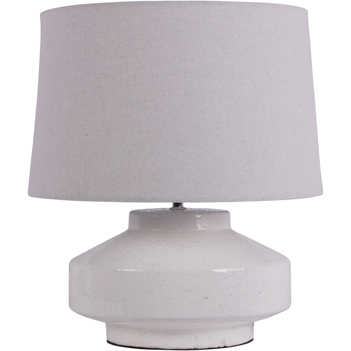 Cloud Table Lamp with a broad off-white drum shade and low white base with sloping shoulders and a short circular foot.