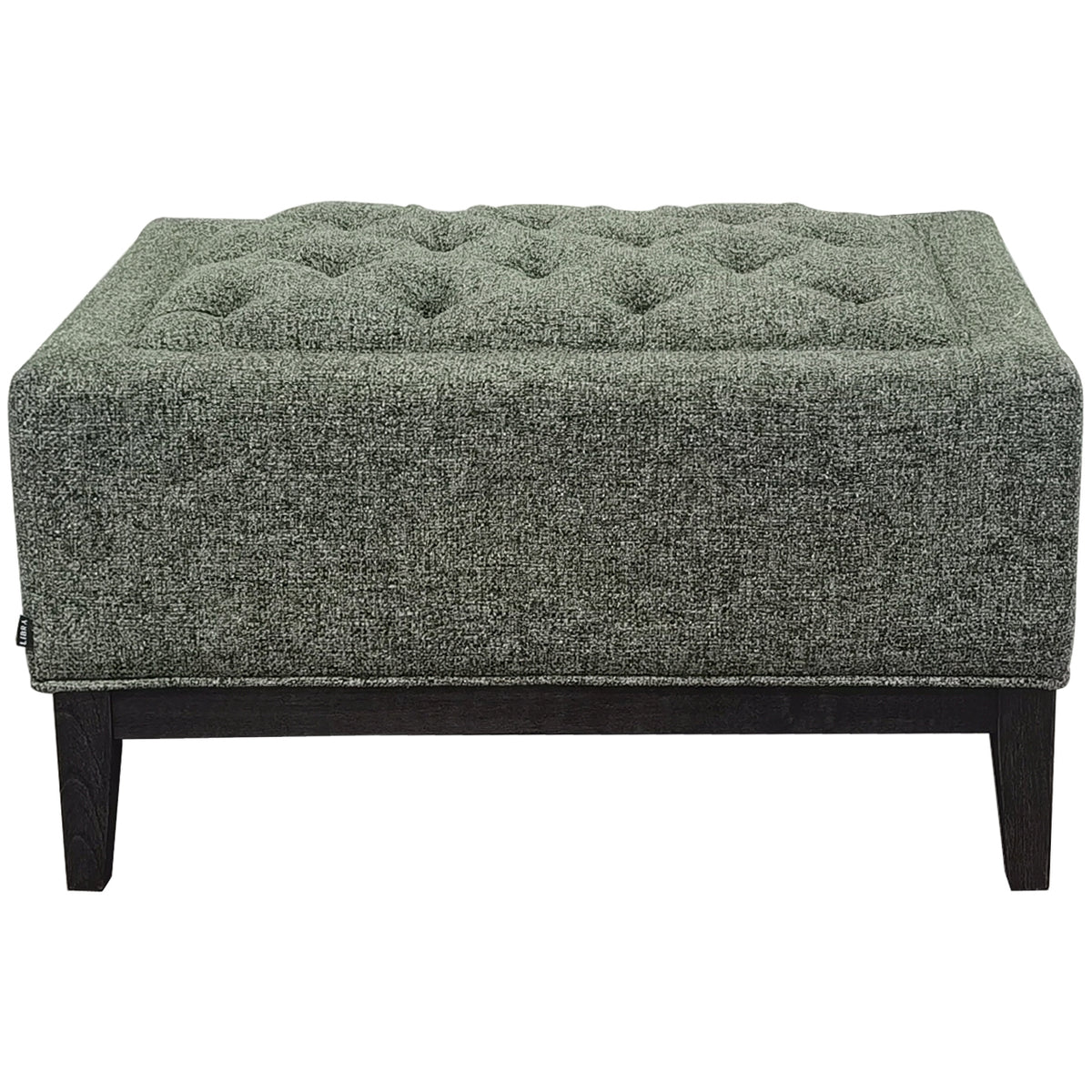 Front view of the green upholstered stool with a deeply buttoned top, piped edges and dark wooden tapered legs on white.
