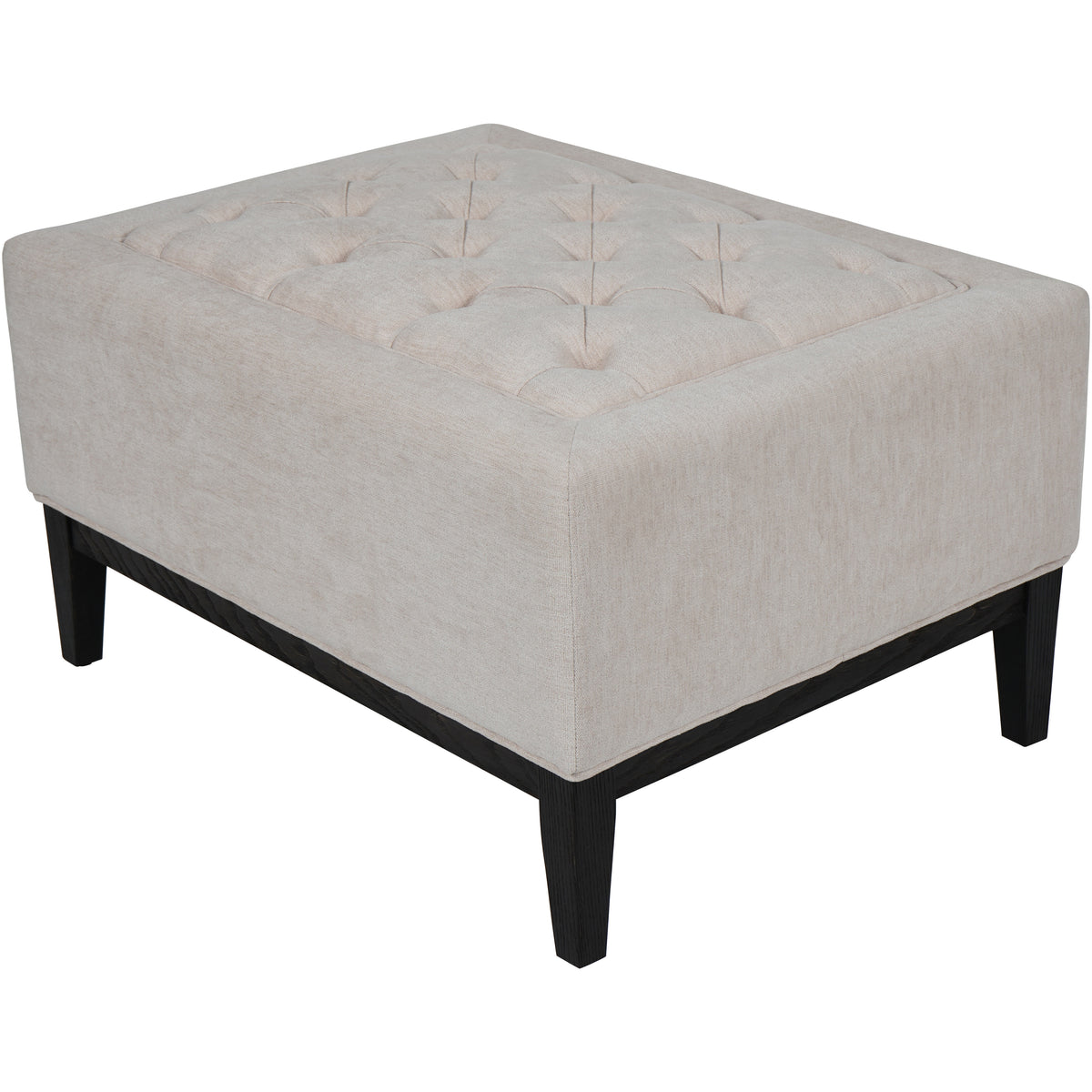 Angled view of the footstool showing its broad rectangular body, tufted top and ivory upholstery above a dark brown wooden base.