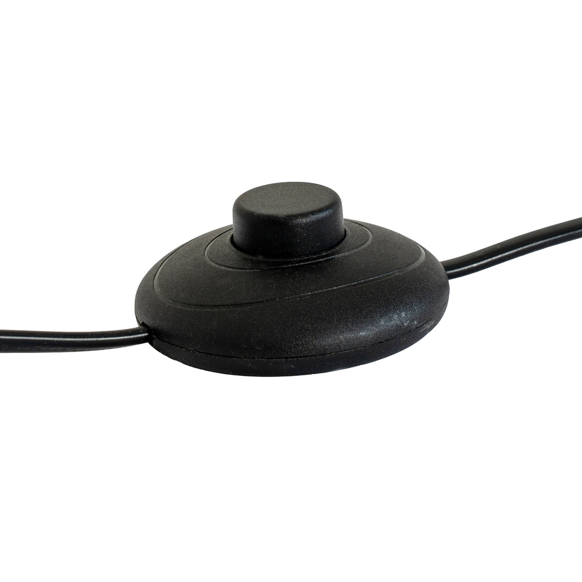 Close-up of a black round inline foot switch with a raised central button and cable extending from both sides.