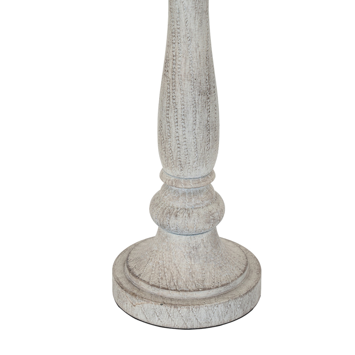 Close-up of the lamp's lower stem and broad circular foot, showing curved collar details and fine darker markings through the pale finish.