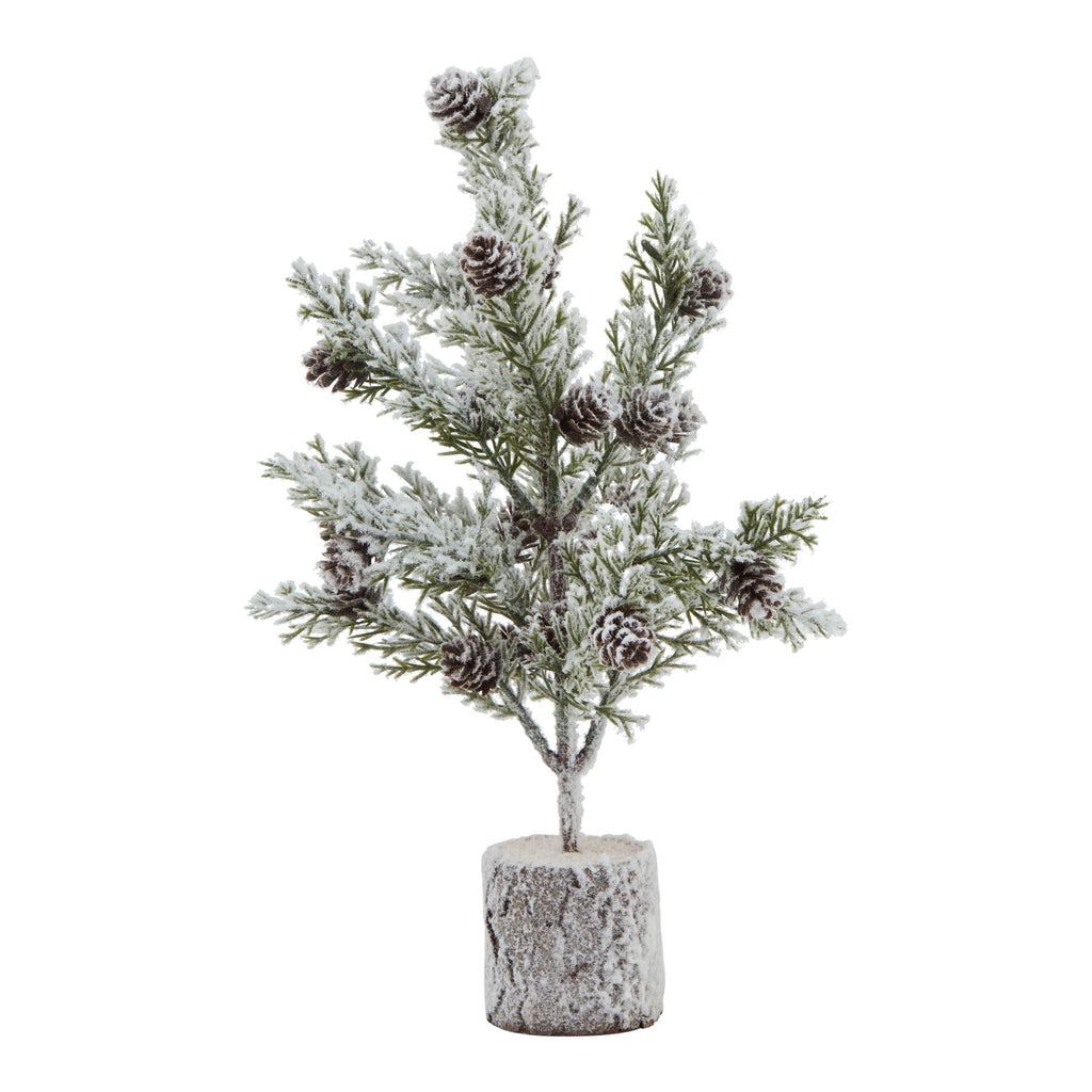 Full view of a miniature green tree with brown cone shapes, snowy white branches and a cylindrical bark-textured base.
