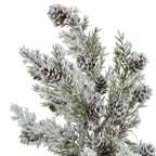 Close-up of brown layered cone shapes among green needle-like branches covered with a fluffy white snow effect.