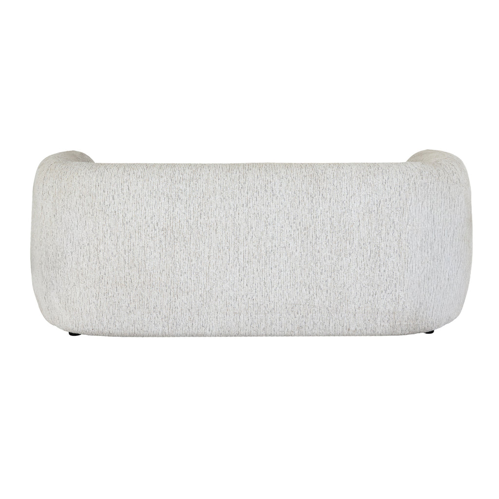 Rear view of the pale cream sofa, showing its broad curved back, rounded ends and finely flecked surface.
