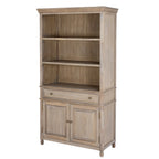 Three-quarter front view of the tan-grey Contour Panel Dresser with three open upper compartments, a closed drawer and two closed panelled doors.